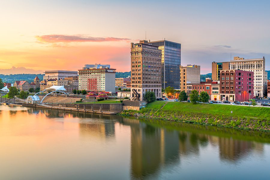 Contact - Charleston, West Virginia City Skyline in Front of River at Sunset